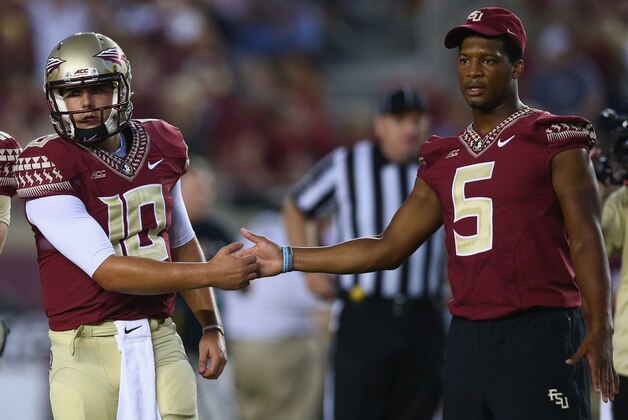TALLAHASSEE, FL - SEPTEMBER 20:  Jameis Winston #5 of the Florida State Seminoles shakes hands with Sean Maguire #10 on the field during pregame against the Clemson Tigers at Doak Campbell Stadium on September 20, 2014 in Tallahassee, Florida.  (Photo by Ronald Martinez/Getty Images)