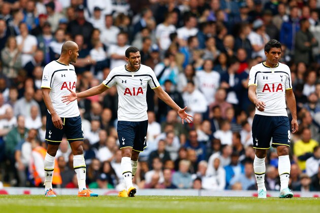 LONDON, ENGLAND - SEPTEMBER 21:  Etienne Capoue of Spurs reacts angrily as teammates Younes Kaboul (L) and Paulinho (R) look on after conceding a goal during the Barclays Premier League match between Tottenham Hotspur and West Bromwich Albion at White Hart Lane on September 21, 2014 in London, England.  (Photo by Julian Finney/Getty Images)
