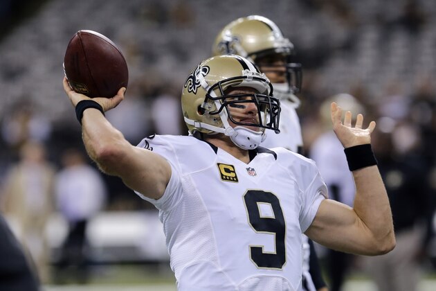 New Orleans Saints quarterback Drew Brees (9) warms up before an NFL football game against the Minnesota Vikings in New Orleans, Sunday, Sept. 21, 2014. (AP Photo/Bill Haber)