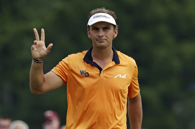 Joost Luiten, of the Netherlands, waves after making a birdie putt on the first hole during the final round of the PGA Championship golf tournament at Valhalla Golf Club on Sunday, Aug. 10, 2014, in Louisville, Ky. (AP Photo/John Locher)