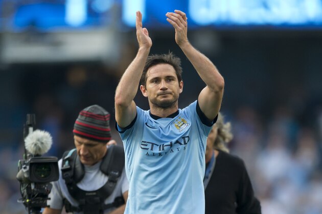 Manchester City's Frank Lampard applauds supporters after his team's 1-1 draw against Chelsea during their English Premier League soccer match at the Etihad Stadium, Manchester, England, Sunday Sept. 21, 2014. Lampard scored the equalizing goal after an opening goal by Chelsea's Andre Schurrle. (AP Photo/Jon Super)