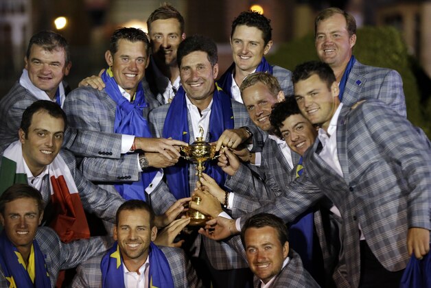 The European team posses with the trophy after winning the Ryder Cup PGA golf tournament Sunday, Sept. 30, 2012, at the Medinah Country Club in Medinah, Ill. (AP Photo/David J. Phillip)