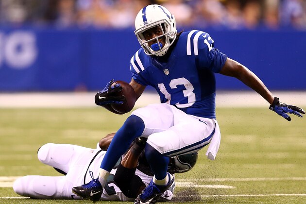 INDIANAPOLIS, IN - SEPTEMBER 15:  Wide receiver T.Y. Hilton #13 of the Indianapolis Colts is tackled by cornerback Brandon Boykin #22 of the Philadelphia Eagles during a game at Lucas Oil Stadium on September 15, 2014 in Indianapolis, Indiana.  (Photo by Andy Lyons/Getty Images)