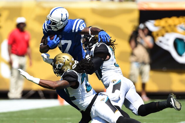 JACKSONVILLE, FL - SEPTEMBER 21: Reggie Wayne #87 of the Indianapolis Colts runs with a catch against Winston Guy, Jr. #22 and Johnathan Cyprien #37 of the Jacksonville Jaguars at EverBank Field on September 21, 2014 in Jacksonville, Florida. (Photo by Scott Cunningham/Getty Images)