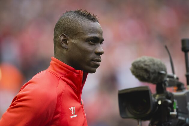 Liverpool's Mario Balotelli takes to the pitch for his team's English Premier League soccer match against Aston Villa at Anfield Stadium, Liverpool, England, Saturday Sept. 13, 2014. (AP Photo/Jon Super)