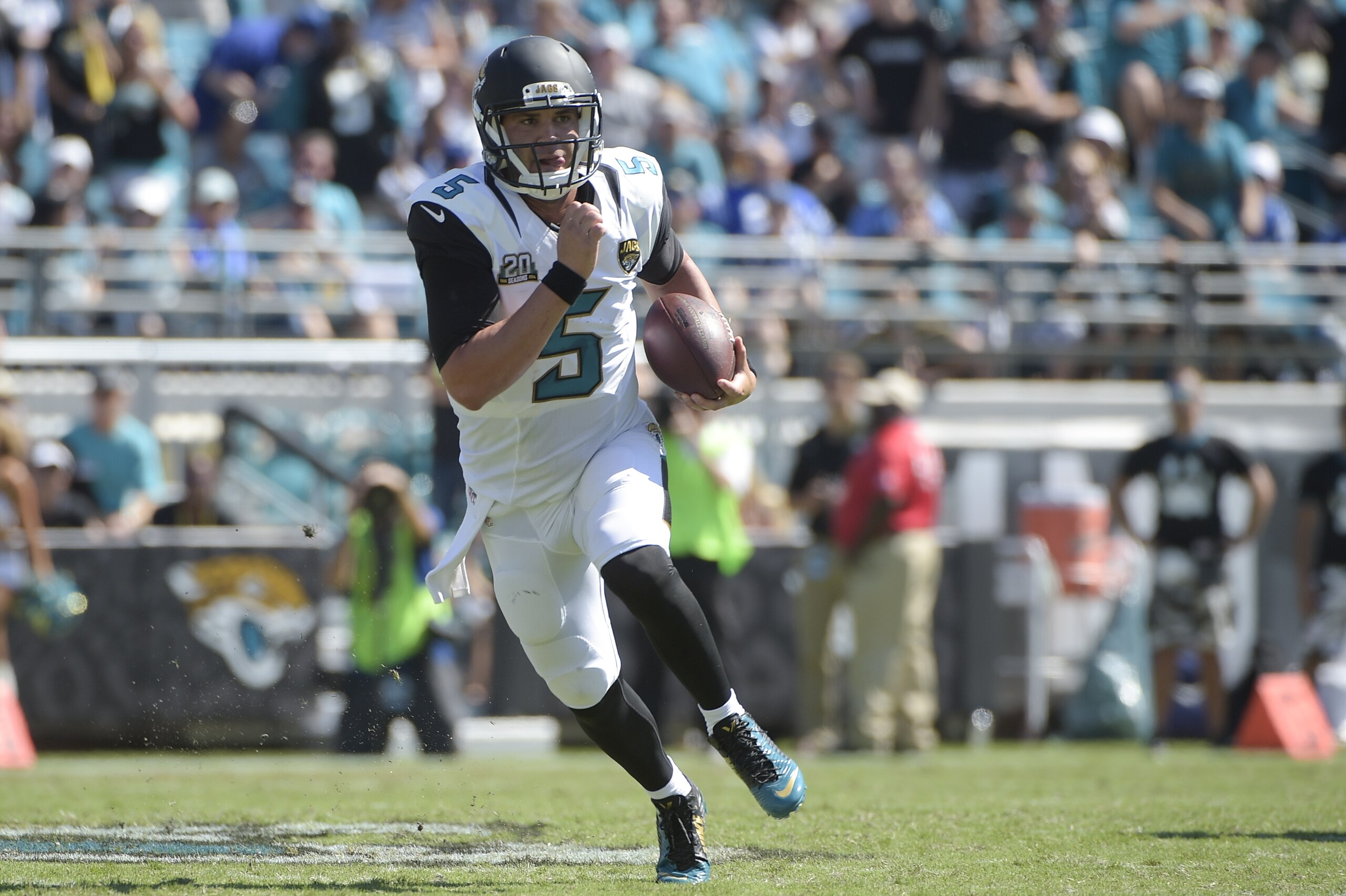 Jacksonville Jaguars quarterback Blake Bortles (5) scrambles for yardage against the Indianapolis Colts during the second half of an NFL football game in Jacksonville, Fla., Sunday, Sept. 21, 2014. (AP Photo/Phelan M. Ebenhack)