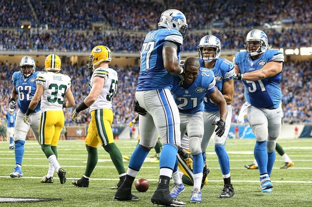 DETROIT, MI - SEPTEMBER 21: Reggie Bush #21 of the Detroit Lions celebrates with teammates Cornelius Lucas #77 and Dominic Raiola #51 after scoring on a 21 yard touchdown during the fourth quarter of the game against the Bay Packers at Ford Field on September 21, 2014 in Detroit, Michigan. The Lions defeated the Packers 19-7. (Photo by Leon Halip/Getty Images) DETROIT, MI - SEPTEMBER 21: Reggie Bush #21 of the Detroit Lions celebrates with teammates Cornelius Lucas #77 and Dominic Raiola #51 after scoring on a 21 yard touchdown during the fourth quarter of the game against the Bay Packers at Ford Field on September 21, 2014 in Detroit, Michigan. The Lions defeated the Packers 19-7. (Photo by Leon Halip/Getty Images)