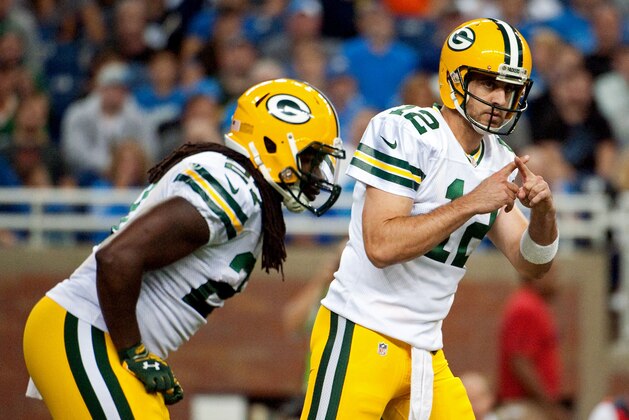 Sep 21, 2014; Detroit, MI, USA; Green Bay Packers quarterback Aaron Rodgers (12) signals a play during the game against the Detroit Lions at Ford Field. Mandatory Credit: Tim Fuller-USA TODAY Sports Sep 21, 2014; Detroit, MI, USA; Green Bay Packers quarterback Aaron Rodgers (12) signals a play during the game against the Detroit Lions at Ford Field. Mandatory Credit: Tim Fuller-USA TODAY Sports