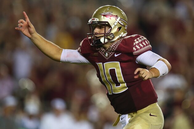 TALLAHASSEE, FL - SEPTEMBER 20:  Sean Maguire #10 of the Florida State Seminoles celebrates the overtime win against the Clemson Tigers at Doak Campbell Stadium on September 20, 2014 in Tallahassee, Florida.  (Photo by Ronald Martinez/Getty Images)