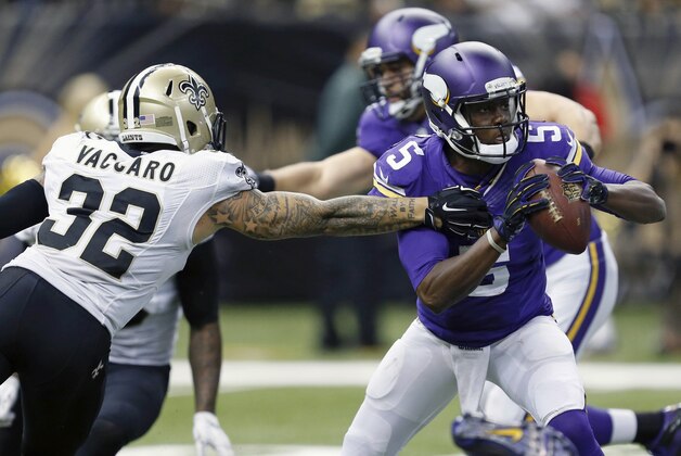 New Orleans Saints strong safety Kenny Vaccaro (32) pressures Minnesota Vikings quarterback Teddy Bridgewater (5) in the second half of an NFL football game in New Orleans, Sunday, Sept. 21, 2014. (AP Photo/Rogelio Solis)