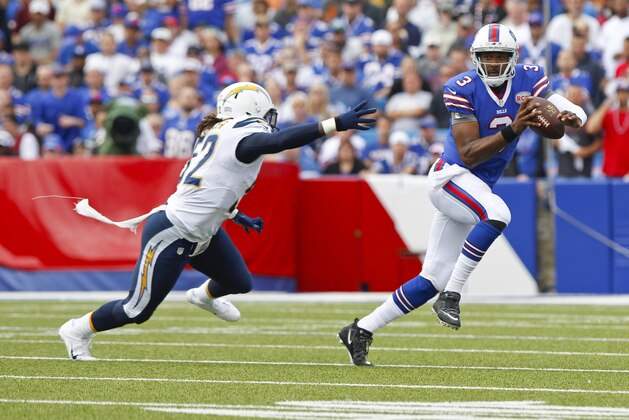 Buffalo Bills quarterback EJ Manuel (3) scrambles away from San Diego Chargers' Reggie Walker (52) during the first half of an NFL football game Sunday, Sept. 21, 2014, in Orchard Park, N.Y. (AP Photo/Bill Wippert)