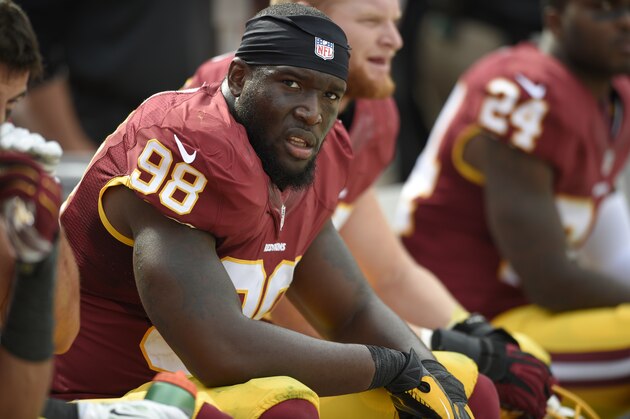 Washington Redskins outside linebacker Brian Orakpo (98) looks on from the bench during the second half of an NFL football game against the Jacksonville Jaguars, Sunday, Sept. 14, 2014, in Landover, Md. The Redskins won 41-10. (AP Photo/Nick Wass)
