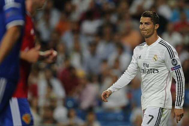 Real's Cristiano Ronaldo reats during the Champions League Group B soccer match between Real Madrid and Basel at the Santiago Bernabeu stadium in Madrid, Spain, Tuesday, Sept. 16, 2014. (AP Photo/Andres Kudacki)