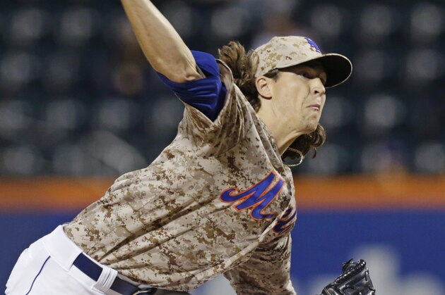 New York Mets starting pitcher Jacob deGrom (48) delivers in the first inning of a baseball game in New York, Monday, Sept. 15, 2014. (AP Photo/Kathy Willens)