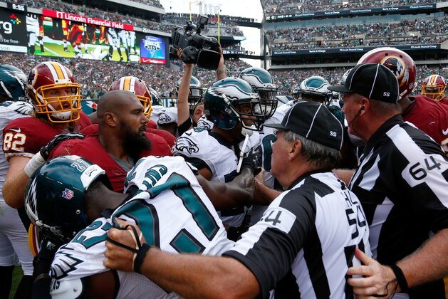 Officials try to break up a scuffle between the Washington Redskins and Philadelphia Eagles during the second half of an NFL football game, Sunday, Sept. 21, 2014, in Philadelphia. (AP Photo/Matt Rourke) Officials try to break up a scuffle between the Washington Redskins and Philadelphia Eagles during the second half of an NFL football game, Sunday, Sept. 21, 2014, in Philadelphia. (AP Photo/Matt Rourke)