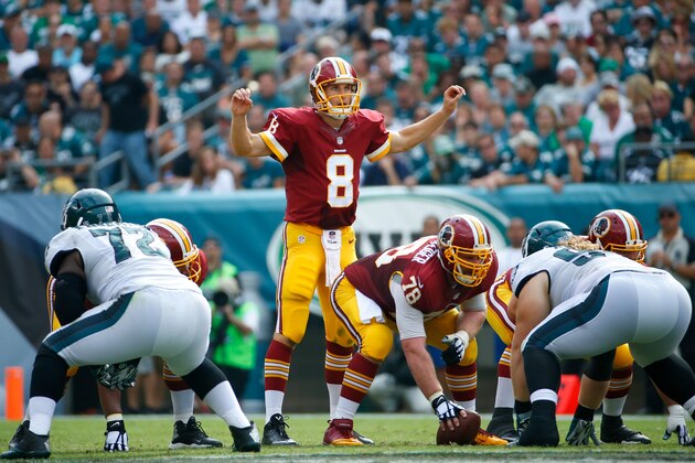Washington Redskins' Kirk Cousins calls a play during the second half of an NFL football game against the Philadelphia Eagles, Sunday, Sept. 21, 2014, in Philadelphia. (AP Photo/Matt Rourke)