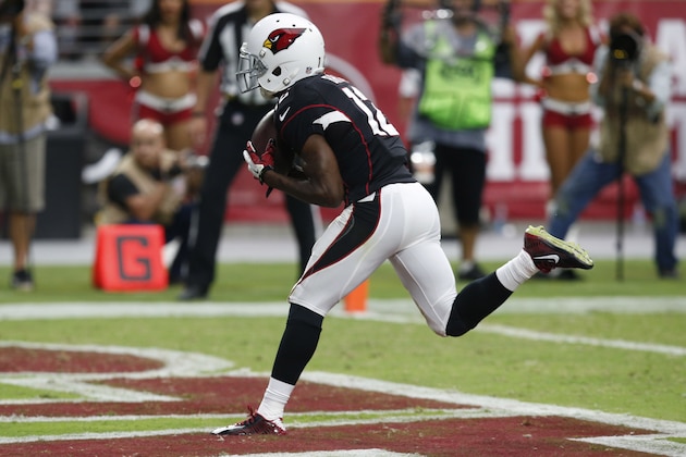 Arizona Cardinals wide receiver John Brown (12) scores a touchdown against the San Francisco 49ers during the second half of an NFL football game, Sunday, Sept. 21, 2014, in Glendale, Ariz. (AP Photo/Ross D. Franklin)