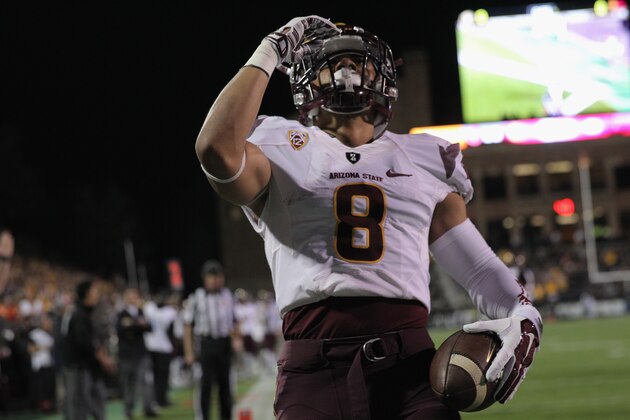BOULDER, CO - SEPTEMBER 13:  Running back D.J. Foster #8 of the Arizona State Sun Devils celebrates his 15 yard touchdown against the Colorado Buffaloes to give the Sun Devils a 7-0 lead in the first quarter at Folsom Field on September 13, 2014 in Boulder, Colorado.  (Photo by Doug Pensinger/Getty Images)