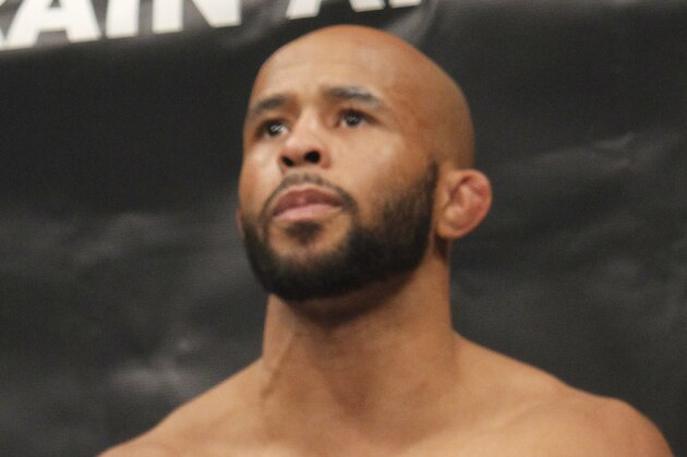 Defending Champion Demetrious Johnson warms up before fighting Joseph Benavidez  for the UFC Flyweight Mixed Martial Arts title in Sacramento, Calif., on Saturday, Dec. 14, 2013.(AP Photo/Steve Yeater)