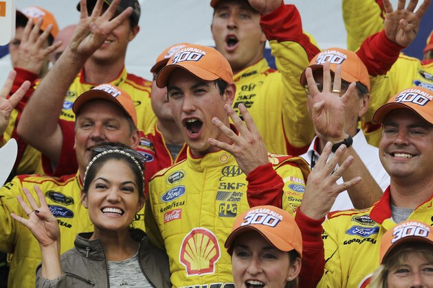Driver Joey Logano celebrates, after winning his fourth win of the season, in Victory Lane after winning the Sylvania 300 at New Hampshire Motor Speedway, Loudon, N.H., Sunday, Sept. 21, 2014  (AP Photo/Cheryl Senter)
