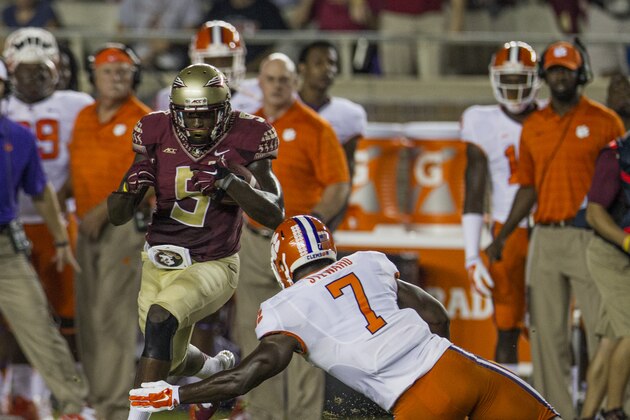 Florida State running back Karlos Williams, left, gets past Clemson linebacker Tony Steward in the 1st half of their NCAA college football game in Tallahassee, Fla., Saturday, Sept. 20, 2014. Florida State defeated Clemson 23-17 in overtime. (AP Photo/Mark Wallheiser) Florida State running back Karlos Williams, left, gets past Clemson linebacker Tony Steward in the 1st half of their NCAA college football game in Tallahassee, Fla., Saturday, Sept. 20, 2014. Florida State defeated Clemson 23-17 in overtime. (AP Photo/Mark Wallheiser)