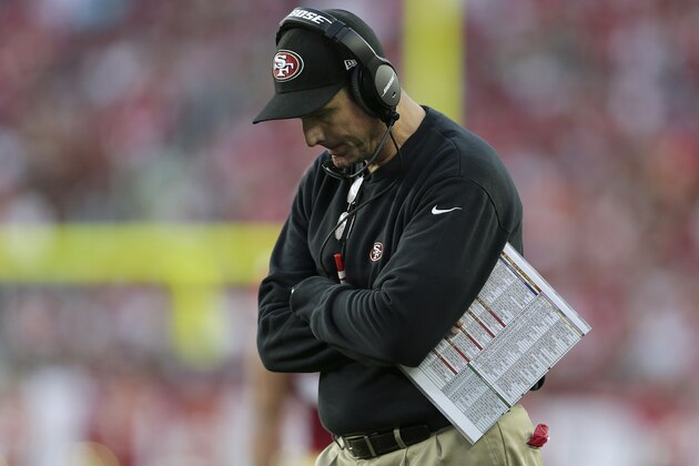 San Francisco 49ers head coach Jim Harbaugh stands on the sideline during the second quarter of an NFL football game against the Chicago Bears in Santa Clara, Calif., Sunday, Sept. 14, 2014. (AP Photo/Marcio Jose Sanchez)