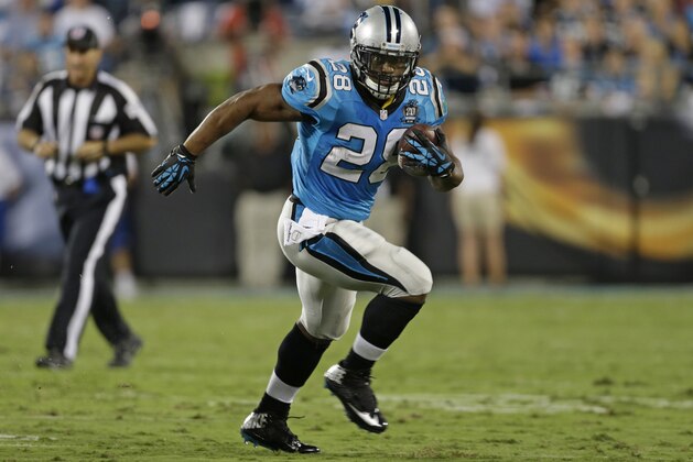Carolina Panthers' Jonathan Stewart (28) runs against the Pittsburgh Steelers during the first half of an NFL football game in Charlotte, N.C., Sunday, Sept. 21, 2014. (AP Photo/Bob Leverone)