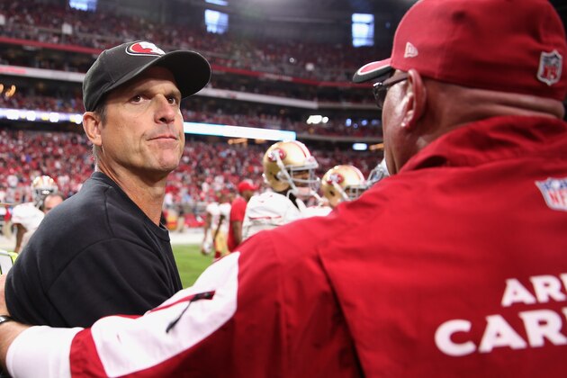GLENDALE, AZ - SEPTEMBER 21:  Head coach Jim Harbaugh of the San Francisco 49ers shakes hands with head coach Bruce Arians of the Arizona Cardinals following the NFL game at the University of Phoenix Stadium on September 21, 2014 in Glendale, Arizona.  The Cardinals defeated the 49ers 23-14.  (Photo by Christian Petersen/Getty Images)