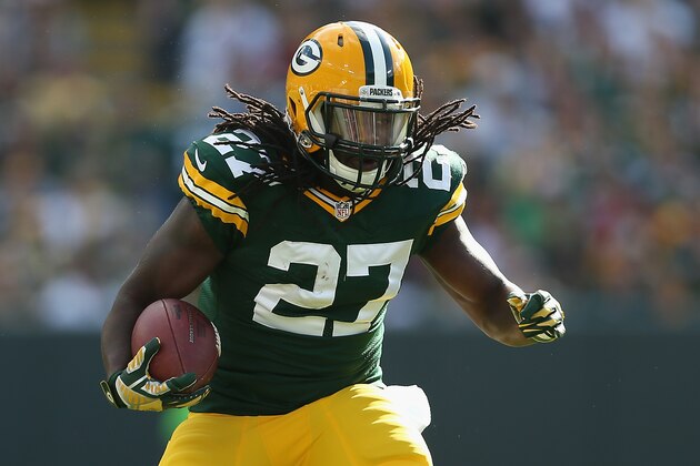 GREEN BAY, WI - SEPTEMBER 14:  Running back Eddie Lacy #27 of the Green Bay Packers rushes the football against the New York Jets during the NFL game at Lambeau Field on September 14, 2014 in Green Bay, Wisconsin.  The Packers defeated the Jets 31-24.  (Photo by Christian Petersen/Getty Images)
