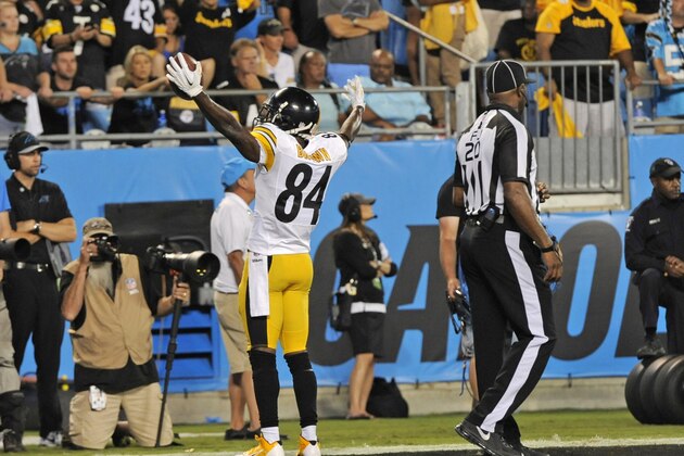 Pittsburgh Steelers' Antonio Brown reacts after a touchdown catch against the Carolina Panthers during the second half of an NFL football game in Charlotte, N.C., Sunday, Sept. 21, 2014. (AP Photo/Mike McCarn)