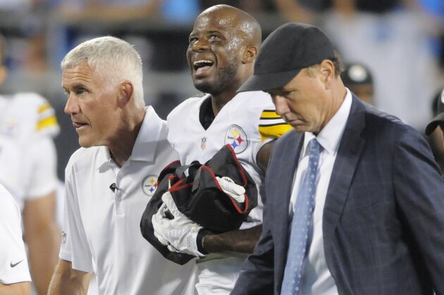 Pittsburgh Steelers' Ike Taylor, center is helped off the field by team members during the second half of an NFL football game against the Carolina Panthers in Charlotte, N.C., Sunday, Sept. 21, 2014. (AP Photo/Mike McCarn)