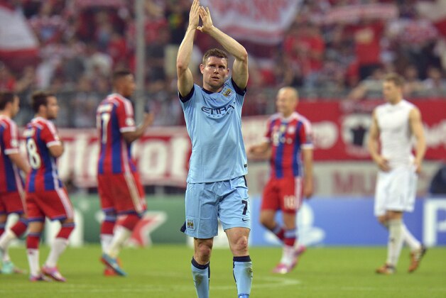 Manchester City's James Milner applauds to supporters after the Champions League group E soccer match between Bayern Munich and Manchester City in Munich, Germany, Wednesday Sept.17,2014. (AP Photo/Kerstin Joensson)