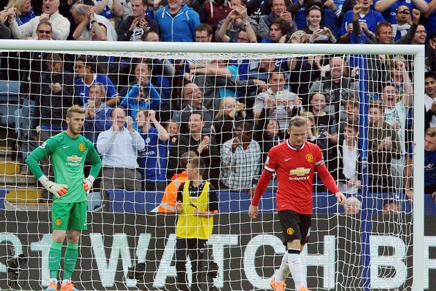 Manchester United players David De Gea, left, and Wayne Rooney react after Leicester's Jamie Vardy scored against Manchester United  during the English Premier League soccer match between Leicester City and Manchester United at King Power Stadium, in Leicester, England, Sunday, Sept. 21, 2014.  (AP Photo/Rui Vieira)