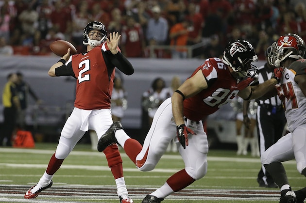 Atlanta Falcons quarterback Matt Ryan (2) works against the Tampa Bay Buccaneers during the first half of an NFL football game, Thursday, Sept. 18, 2014, in Atlanta. (AP Photo/David Goldman)