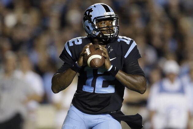 North Carolina quarterback Marquise Williams (12) looks to pass during the first half of an NCAA college football game against San Diego State in Chapel Hill, N.C., Saturday, Sept. 6, 2014. (AP Photo/Gerry Broome)
