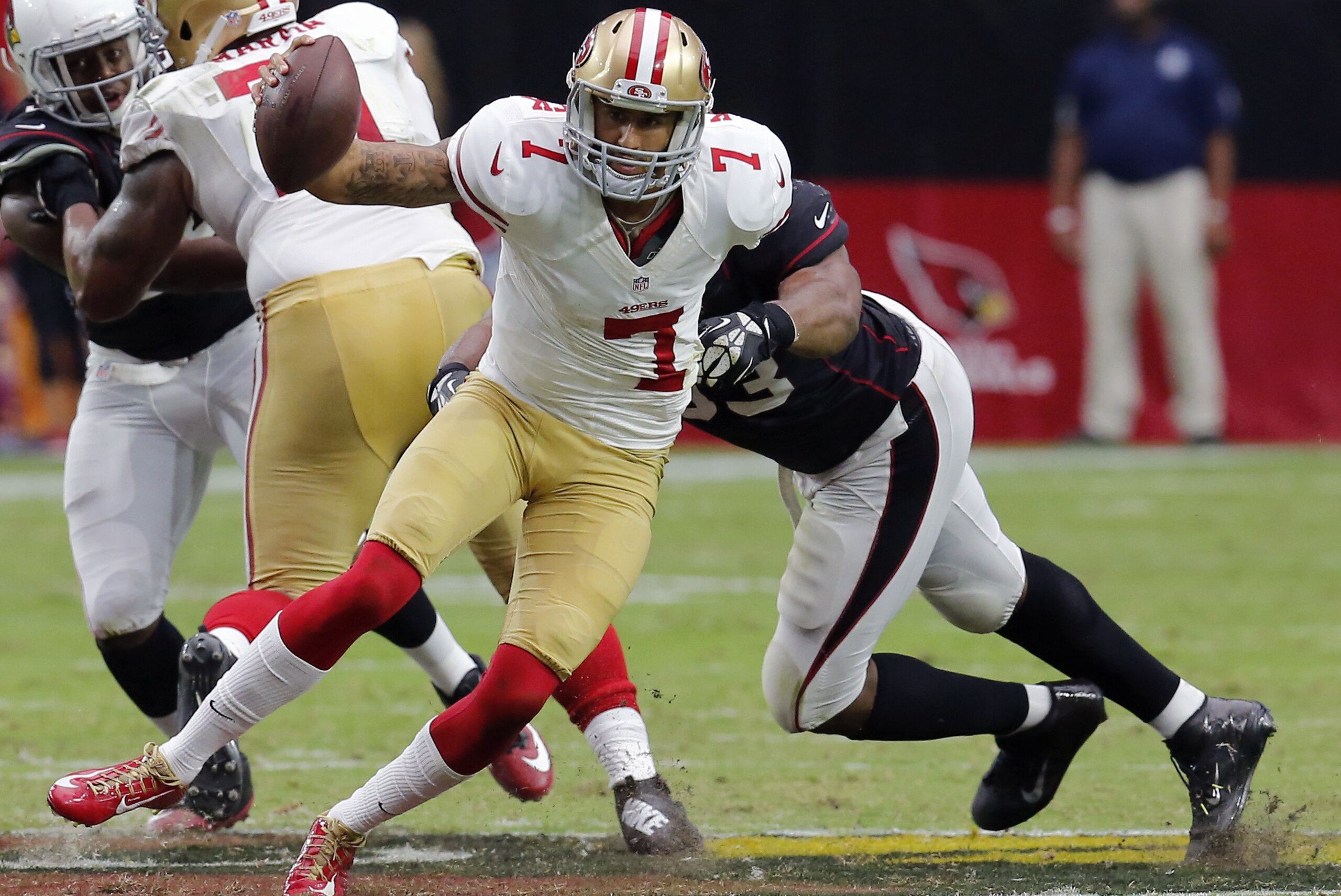 San Francisco 49ers quarterback Colin Kaepernick (7) is hit by Arizona Cardinals defensive end Calais Campbell (93) during the first half of an NFL football game, Sunday, Sept. 21, 2014, in Glendale, Ariz. (AP Photo/Rick Scuteri) San Francisco 49ers quarterback Colin Kaepernick (7) is hit by Arizona Cardinals defensive end Calais Campbell (93) during the first half of an NFL football game, Sunday, Sept. 21, 2014, in Glendale, Ariz. (AP Photo/Rick Scuteri)