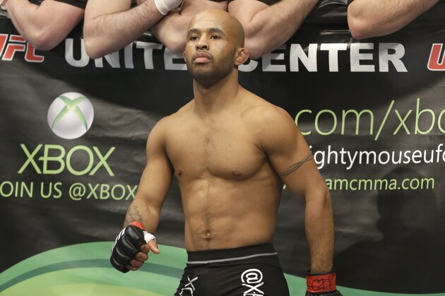 Demetrious Johnson stands in the ring before fighting with John Dodson during UFC World Flyweight Championship on FOX 6 at the United Center in Chicago, Saturday, Jan. 26, 2013. Johnson won the bout. (AP Photo/Nam Y. Huh)