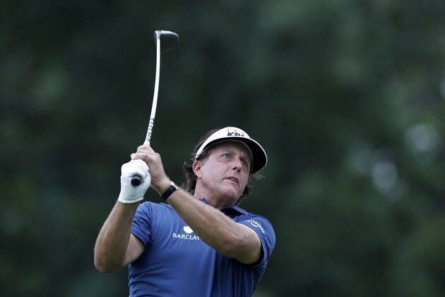 Phil Mickelson hits a tee shot on the18th hole during the first round of play at The Barclays golf tournament Thursday, Aug. 21, 2014, in Paramus, N.J.  (AP Photo/Mel Evans)