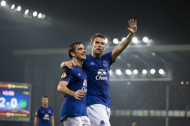 Everton's Seamus Coleman, centre right, celebrates alongside teammate Leighton Baines after scoring against Wolfsburg during their Europa League Group H soccer match at Goodison Park Stadium, Liverpool, England, Thursday Sept. 18, 2014. (AP Photo/Jon Super)