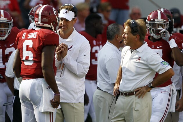 Alabama offensive coordinator Lane Kiffin talks with Blake Simms as Nick Saban listens in during the first half of an NCAA college football game against Florida on Saturday, Sept. 20, 2014, in Tuscaloosa, Ala. (AP Photo/Butch Dill)