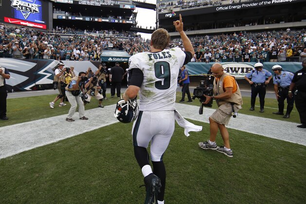 Philadelphia Eagles quarterback Nick Foles runs off the field after an NFL football game against the Washington Redskins, Sunday, Sept. 21, 2014, in Philadelphia. Philadelphia won 37-34. (AP Photo/Michael Perez)
