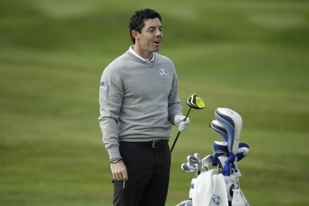 Europe Ryder Cup team player Rory McIlroy holds a club as he practices on the driving range ahead of the start of the Ryder Cup golf tournament in Gleneagles, Scotland, Monday, Sept. 22, 2014.  The U.S. team arrived for the Ryder Cup Monday, with the tournament starting on Friday.  (AP Photo/Matt Dunham)