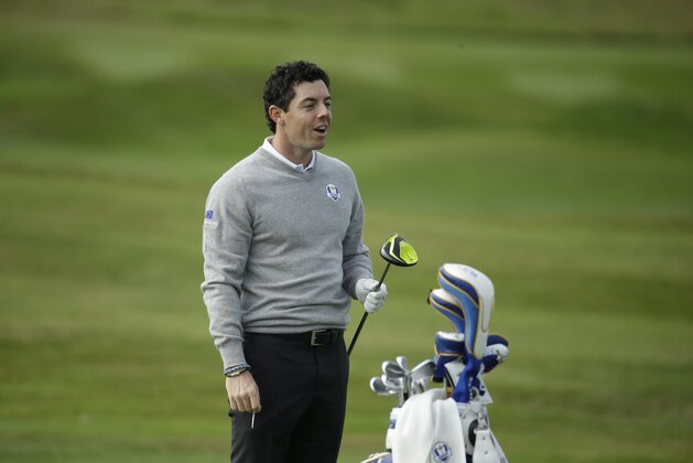 Europe Ryder Cup team player Rory McIlroy holds a club as he practices on the driving range ahead of the start of the Ryder Cup golf tournament in Gleneagles, Scotland, Monday, Sept. 22, 2014.  The U.S. team arrived for the Ryder Cup Monday, with the tournament starting on Friday.  (AP Photo/Matt Dunham)