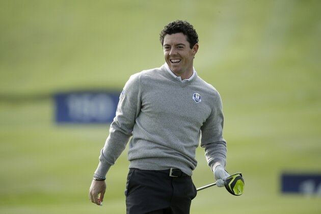 Europe's Rory McIlroy laughs as he practices on the driving range ahead of the start of the Ryder Cup golf tournament in Gleneagles, Scotland, Monday, Sept. 22, 2014.  The U.S. team arrives for the Ryder Cup Monday, with the tournament  starting on Friday.  (AP Photo/Matt Dunham)