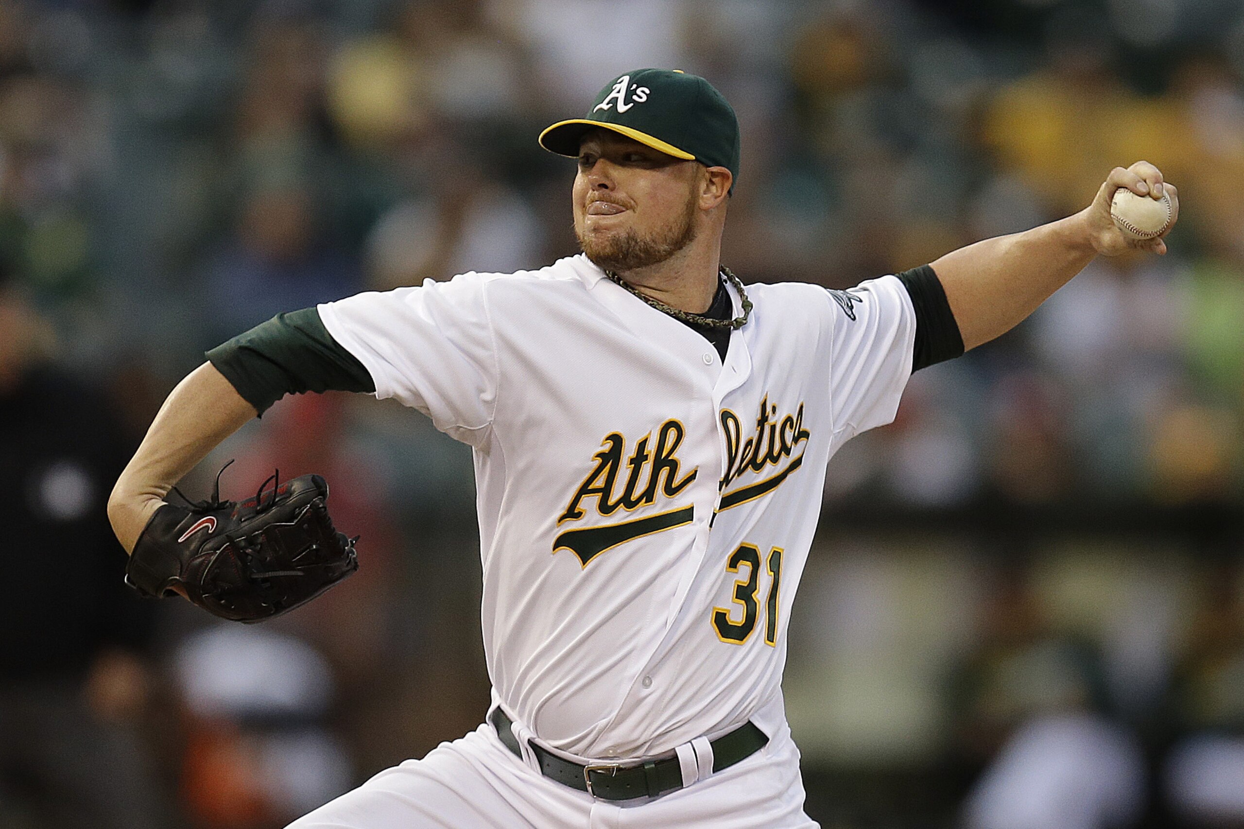 Oakland Athletics' Jon Lester works against the Philadelphia Phillies in the first inning of a baseball game Friday, Sept. 19, 2014, in Oakland, Calif. (AP Photo/Ben Margot)