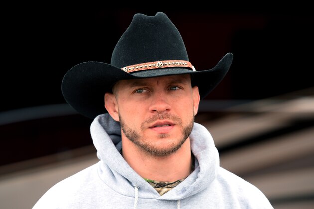 DAYTONA BEACH, FL - FEBRUARY 22:  Donald 'Cowboy' Cerrone looks on as he presents NASCAR driver Kevin Harvick (not pictured) with an UFC belt at Daytona International Speedway on February 22, 2014 in Daytona Beach, Florida.  (Photo by Jared C. Tilton/Getty Images)