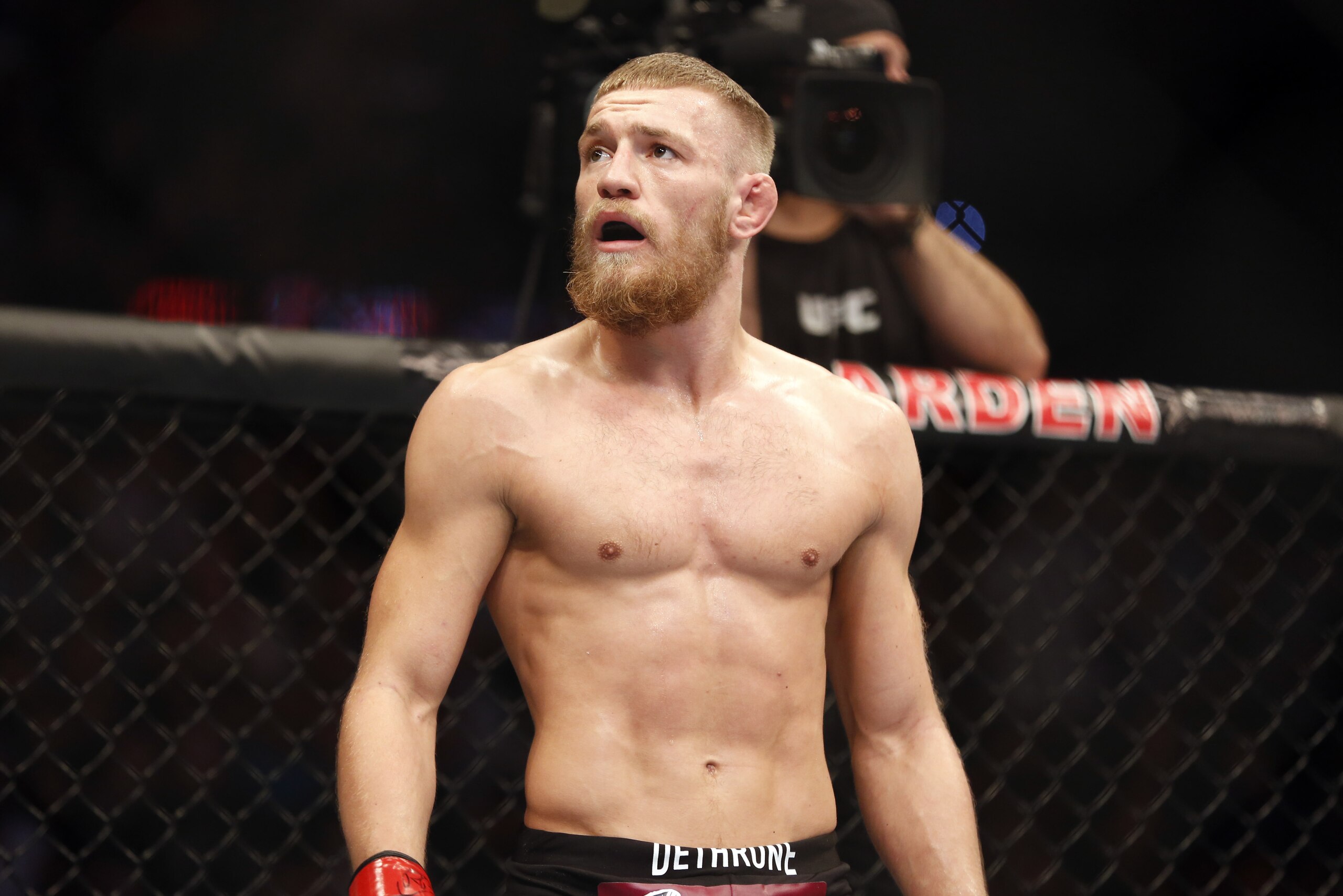 Conor McGregor is seen against Max Holloway in their UFC on Fox Sports 1 mixed martial arts bout in Boston, Saturday, August 17,2013. McGregor won via unanimous decision. (AP Photo/Gregory Payan)