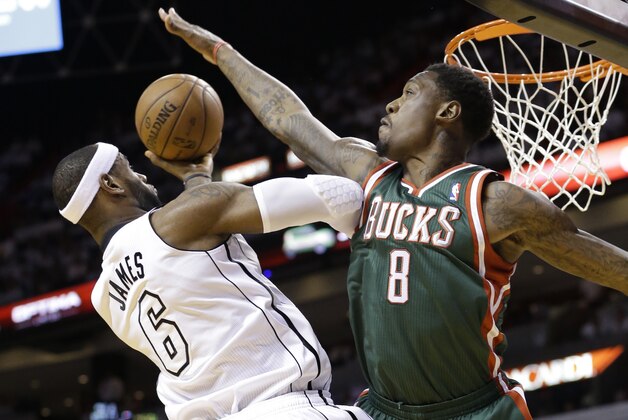 Milwaukee Bucks center Larry Sanders (8) attempts to block a shot by Miami Heat forward LeBron James (6) during the first half of Game 2 in their first-round NBA basketball playoff series, Tuesday, April 23, 2013 in Miami. The Heat defeated the Bucks 98-86. (AP Photo/Wilfredo Lee)