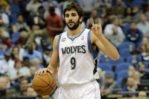 Minnesota Timberwolves guard Ricky Rubio (9), of Spain, gestures to teammates during the fourth quarter of an NBA basketball game against the Chicago Bulls in Minneapolis, Wednesday, April 9, 2014. The Bulls won 102-87. (AP Photo/Ann Heisenfelt)