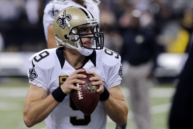 New Orleans Saints quarterback Drew Brees (9) warms up before an NFL football game against the Minnesota Vikings in New Orleans, Sunday, Sept. 21, 2014. (AP Photo/Bill Haber)